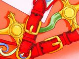 a picture of a red belt with a gold buckle on it