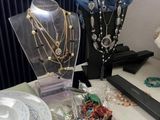 a table with a lot of jewelry on it