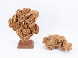 a small sculpture of a bunch of flowers on a stand