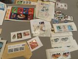 many different types of stamps on the table