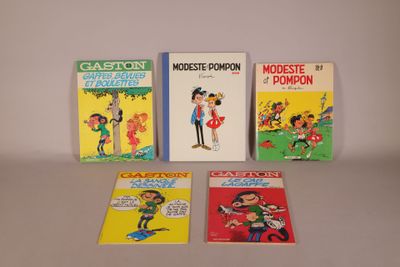 four children ' s books are lined up on a table