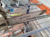 a chainsaw that is sitting on top of a shelf