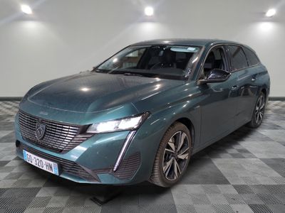 a picture of a blue electric car in a showroom