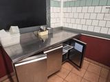 a blackboard on the wall of a public restroom