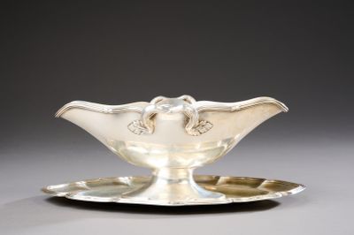 a silver plate with a silver saucer on it