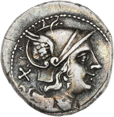 un gros plan d'une pièce de monnaie sur laquelle figure une tête romaine