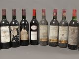 several bottles of wine are lined up in a row