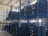 a large rack with tires on it in a warehouse