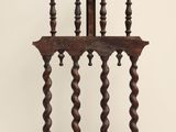 an old wooden chair with a curved back and a wooden seat