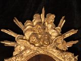 a gold mirror with a bunch of skulls on it