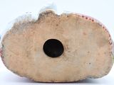 a close up of a vase with a hole in it