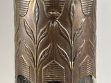 a vase that has a design on the side of it