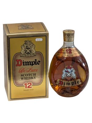 an image of a bottle of dimple scotch whisky next to a box