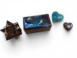 a box that has a heart shaped box and a small box with a bird on it