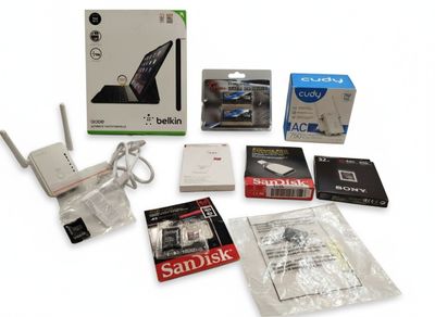 the contents of a laptop and other electronics are shown on a white surface