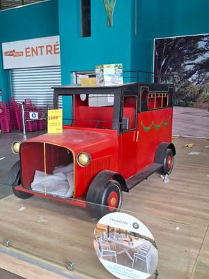 a red truck that is on display in a store