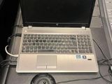 a laptop computer sitting on top of a desk next to a keyboard and mouse
