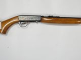a rifle that is laying on top of a table