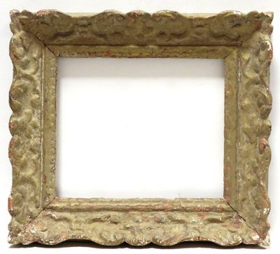 an old picture frame on a white wall with a white background