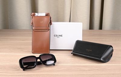 a pair of sunglasses and a case sitting on a table