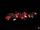 some very pretty red diamonds on a black surface