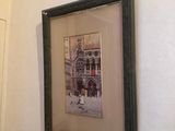 a picture hanging on the wall of a bathroom