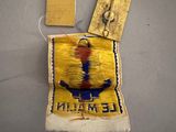 a small patch with a bird on it and a tag attached to it