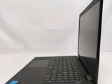 the laptop is open on a white surface with a white background