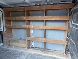 shelves in the back of a van are being built into the wall