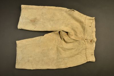 an old pair of pants on a black surface