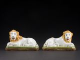 pair of lion figurines in the manner of person