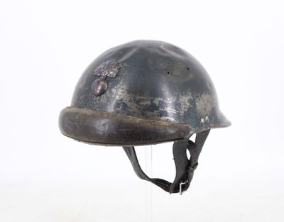 a helmet on a stand on a white surface