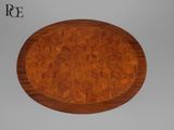 une image représentant une table ronde en bois dont le plateau est orné d'un motif
