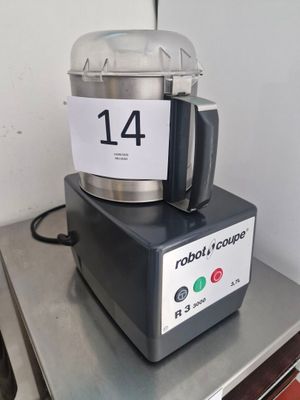 a silver blender sitting on top of a metal counter