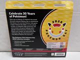packaging for a pokemon birthday cake with a pikachu on top of it