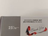 a box with a red and white ribbon on top of it