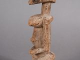 an image of a stone sculpture of a man with a hat on his head