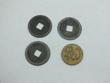 three different types of coins are shown on a white surface