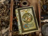 two boxes of assorted items sitting on a table