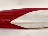 a red and white boat shaped object on a white surface