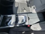 a car seat with a remote control in it