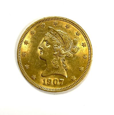 an image of a gold coin with a woman ' s head on it