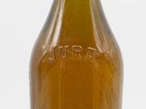 bottles of wine are lined up on a white surface