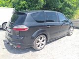 a picture of a black car parked in a parking lot