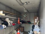 a picture of a garage with a lot of clutter in it