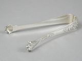 a pair of silverware spoons on a white surface