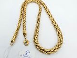 a gold chain with a tag attached to it