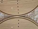 two wooden boards with holes on them on the floor