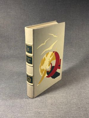 a white book with a red and yellow design on the cover