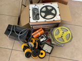 a box with a steering wheel and other items on the floor